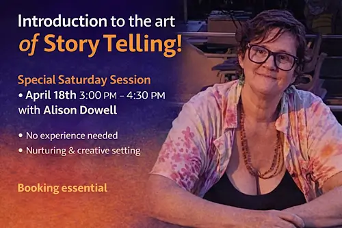 Alison Dowell sits at a table wearing glasses, a colourful tie‑dye shirt, and a beaded necklace, smiling warmly in a softly lit room. Text beside her promotes an “Introduction to the Art of Storytelling” workshop.